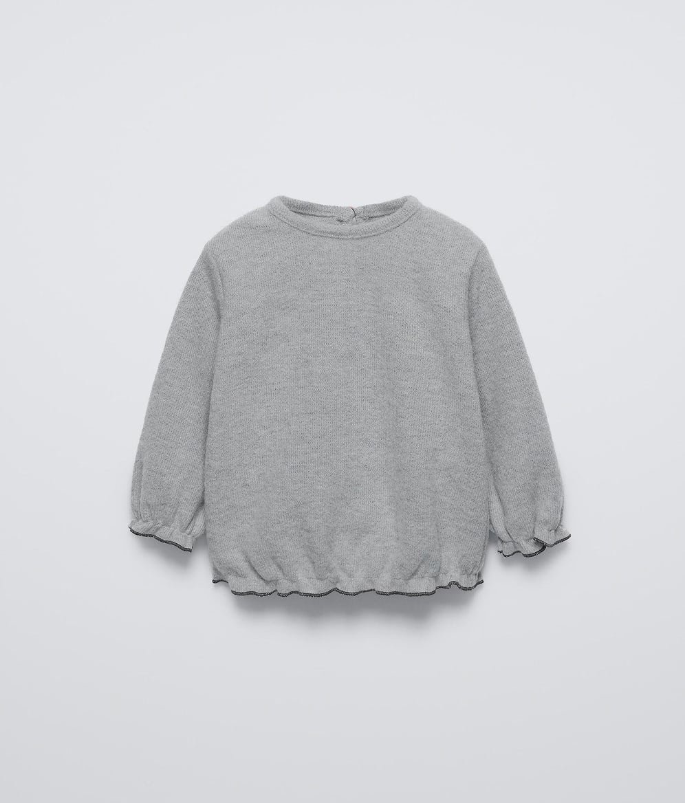 Ruffled knit sweater